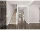 Welcoming foyer with hardwood floors, staircase, and views into the open living spaces at 5430 Flat Rock Pt, Stonecrest, GA 30038