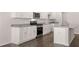 Modern kitchen featuring stainless appliances, granite countertops and stylish white cabinets at 5430 Flat Rock Pt, Stonecrest, GA 30038