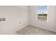 Laundry room with tile floors, utility connections, and a bright window at 5430 Flat Rock Pt, Stonecrest, GA 30038