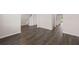 Spacious living room featuring sleek wood-look floors leading to a staircase at 5430 Flat Rock Pt, Stonecrest, GA 30038