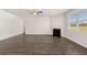 Cozy living area featuring a fireplace and wood-look floors and lots of natural light at 5430 Flat Rock Pt, Stonecrest, GA 30038