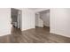 Bright, open-concept layout with durable wood-look floors and neutral paint scheme at 5430 Flat Rock Pt, Stonecrest, GA 30038