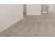 Spacious living room featuring neutral carpeting and freshly painted white walls at 5430 Flat Rock Pt, Stonecrest, GA 30038