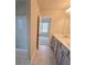 Bathroom featuring double vanity and tile floors at 1107 Kingston Hill Dr, Loganville, GA 30052