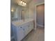 Bathroom featuring a vanity with marble countertop and view to the water closet at 1107 Kingston Hill Dr, Loganville, GA 30052