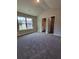 Bedroom with large windows and walk-in closet at 1107 Kingston Hill Dr, Loganville, GA 30052