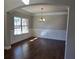 Inviting dining room with hardwood floors, wainscoting, and natural light at 1107 Kingston Hill Dr, Loganville, GA 30052