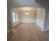 Elegant dining room with hardwood floors, wainscoting, a window, and a modern chandelier at 1107 Kingston Hill Dr, Loganville, GA 30052