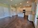 Modern kitchen with white cabinetry, granite countertops, stainless steel appliances, and an island at 1107 Kingston Hill Dr, Loganville, GA 30052