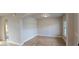 Bright living room featuring hardwood floors, neutral walls, and an archway at 1107 Kingston Hill Dr, Loganville, GA 30052
