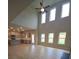 Spacious open-concept living area featuring high ceilings, large windows, and hardwood flooring at 1107 Kingston Hill Dr, Loganville, GA 30052