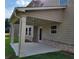 Covered patio area with sturdy support columns, providing an ideal outdoor living space at 1107 Kingston Hill Dr, Loganville, GA 30052