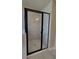 Glass enclosed shower with gray tile surround at 1107 Kingston Hill Dr, Loganville, GA 30052