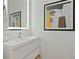 Modern bathroom with a vanity, sleek fixtures, and artistic decor at 560 Dutch Vly # 2313, Atlanta, GA 30324