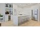 Sleek, modern kitchen with stainless steel appliances, an island, and a built-in bar area at 560 Dutch Vly # 2313, Atlanta, GA 30324