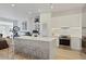 Open-concept kitchen featuring stainless steel appliances, quartz countertops, and modern barstool seating at 560 Dutch Vly # 2313, Atlanta, GA 30324