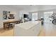 Spacious open living area with a large island, dining table, and modern decor at 560 Dutch Vly # 2313, Atlanta, GA 30324
