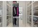 Spacious walk-in closet with glass-front cabinets and ample storage at 560 Dutch Vly # 2313, Atlanta, GA 30324