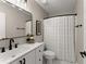 Bathroom features a modern sink, updated fixtures, and patterned shower curtain at 6520 Glen Pond Trce, Cumming, GA 30028