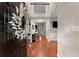 Elegant foyer with hardwood floors, high ceilings, and a view into the home's open layout at 6520 Glen Pond Trce, Cumming, GA 30028