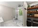 Bright bathroom featuring white subway tile shower and a modern vanity and shelving at 6520 Glen Pond Trce, Cumming, GA 30028