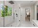 Beautiful bathroom with a walk-in shower, subway tile, and a large window at 6520 Glen Pond Trce, Cumming, GA 30028