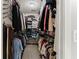 Walk-in closet is organized with racks, shelves, and plenty of storage space at 6520 Glen Pond Trce, Cumming, GA 30028