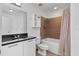 The bathroom features granite counters, white cabinets, and a shower-tub combination at 89 Mangum St # 210, Atlanta, GA 30313