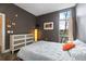 Contemporary bedroom showcasing a large window, stylish furniture, and neutral decor at 89 Mangum St # 210, Atlanta, GA 30313