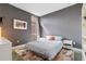 Modern bedroom features a large window, gray walls, and stylish decor at 89 Mangum St # 210, Atlanta, GA 30313