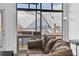 Cozy living area featuring expansive windows with views of the Mercedes-Benz Stadium at 89 Mangum St # 210, Atlanta, GA 30313