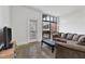 Spacious living room featuring concrete floors and a sliding glass door to a balcony at 89 Mangum St # 210, Atlanta, GA 30313