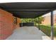 Covered patio providing an ideal outdoor spot for relaxing or entertaining, accessible from the brick house at 264 Rockin Hill Dr, Marietta, GA 30060