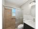 Bathroom featuring tiled shower with glass door, updated vanity, and stylish light fixture at 264 Rockin Hill Dr, Marietta, GA 30060