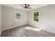 Bedroom boasts ample sunlight, updated flooring, and neutral wall colors at 264 Rockin Hill Dr, Marietta, GA 30060