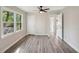 Bedroom boasts updated flooring, a spacious closet, and natural light from the windows at 264 Rockin Hill Dr, Marietta, GA 30060