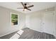 Bright bedroom with updated flooring, ceiling fan, and natural light at 264 Rockin Hill Dr, Marietta, GA 30060