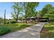 Inviting brick home with a covered carport and a neatly maintained front yard and long driveway at 264 Rockin Hill Dr, Marietta, GA 30060