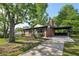 Quaint brick home featuring an attached carport and healthy landscaping at 264 Rockin Hill Dr, Marietta, GA 30060