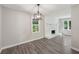 Bright living room with gray floors, fresh paint, white brick fireplace, and updated lighting at 264 Rockin Hill Dr, Marietta, GA 30060