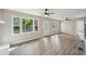 Open living space featuring hardwood floors, abundant natural light, and ceiling fans at 264 Rockin Hill Dr, Marietta, GA 30060