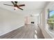 Bright living room with two ceiling fans, hardwood floors, and a brick fireplace at 264 Rockin Hill Dr, Marietta, GA 30060