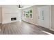Sunlit living room with a fireplace and hardwood floors at 264 Rockin Hill Dr, Marietta, GA 30060