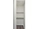 Storage closet with minimalist shelving and updated gray flooring at 264 Rockin Hill Dr, Marietta, GA 30060