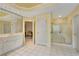 Well-lit bathroom with a glass-enclosed shower and separate vanities at 350 Declaire Ne Way, Marietta, GA 30067