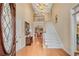 Grand foyer featuring a chandelier, staircase, hardwood floors and decorative stained glass front door at 350 Declaire Ne Way, Marietta, GA 30067