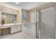 Bright main bathroom with tiled shower, soaking tub, vanity, and shuttered window at 350 Declaire Ne Way, Marietta, GA 30067