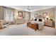 Serene main bedroom features neutral tones, ceiling fan, large windows, and elegant furnishings at 350 Declaire Ne Way, Marietta, GA 30067