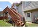 Stairs leading to a backyard with lots of green grass, white siding, and convenient back door access at 116 Remington Place Blvd, Dallas, GA 30157
