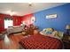 Bedroom with hardwood floors and two beds separated by differently colored walls at 116 Remington Place Blvd, Dallas, GA 30157